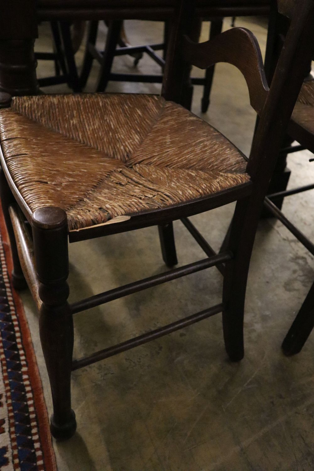 A pair of 19th century ladder-back oak chairs with rush seats